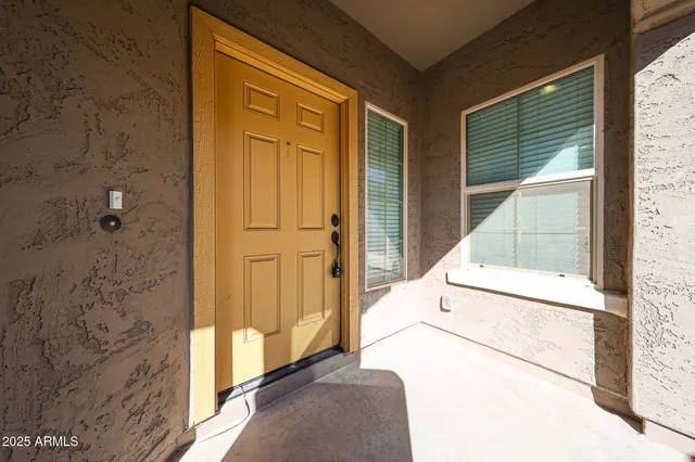a view of a door and wooden floor