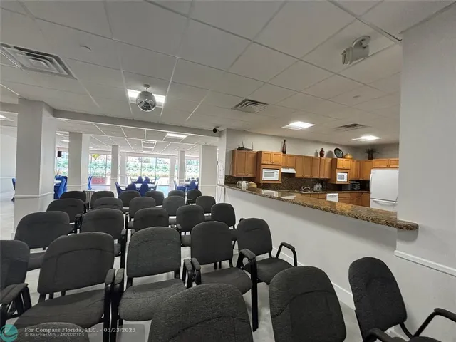 a group of chairs sitting in kitchen and dining room