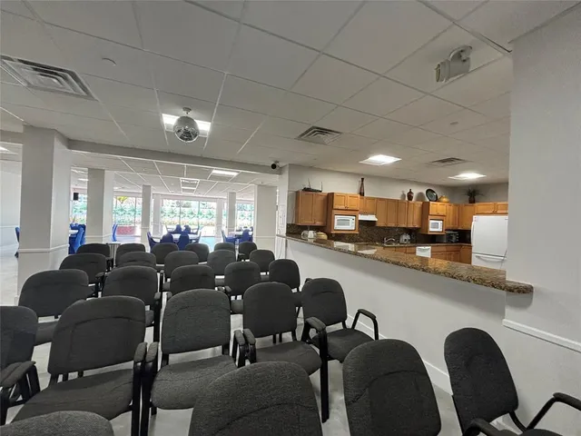 a group of chairs sitting in kitchen and dining room