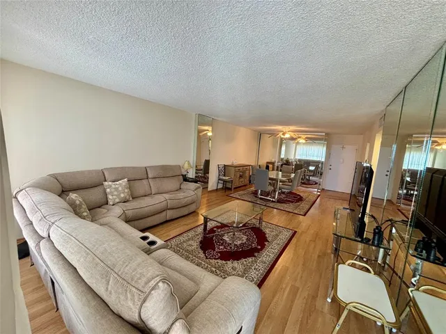 a living room with furniture fireplace and a flat screen tv