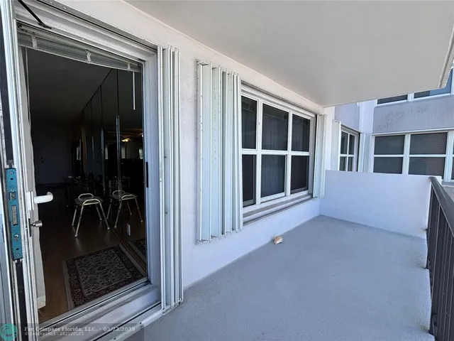 a view of a balcony with an ocean view
