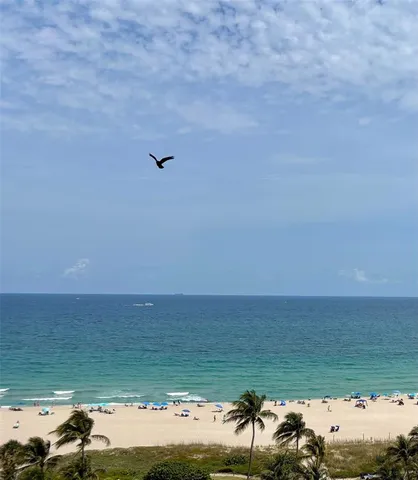 a kitchen with a stove a sink and a refrigerator