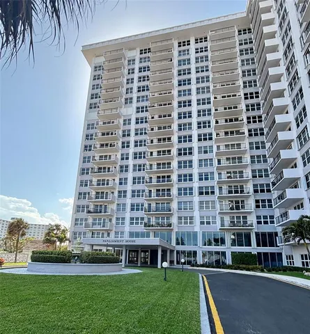 a view of a building with a yard