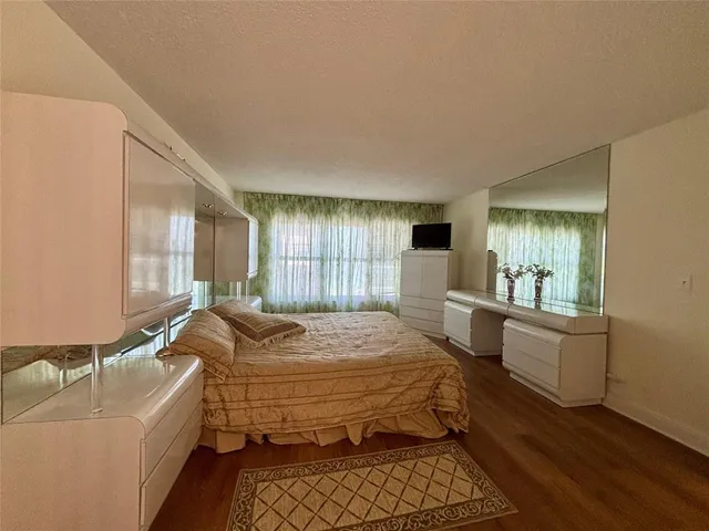 a bathroom with a shower sink and mirror