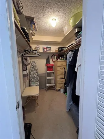 a swimming pool with outdoor seating and plants