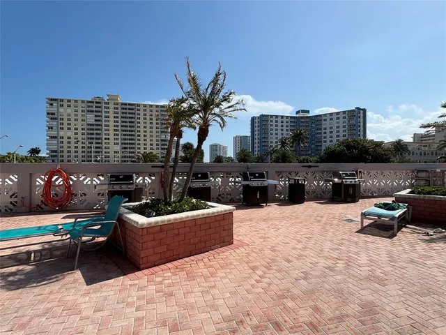 a view of swimming pool with outdoor seating