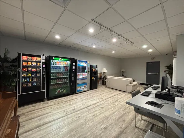 a bed room with a bed and a television