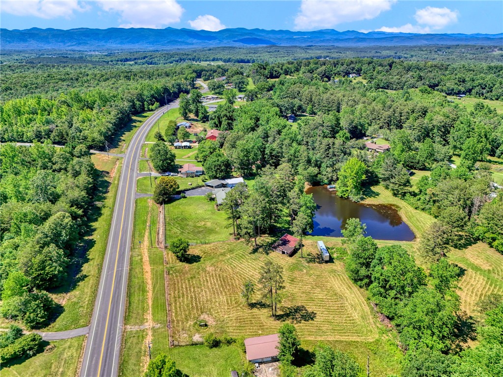 7876 Highway 11 Walhalla, SC 29691 - Photo 2 of 35 Discover a private pond and surrounding wooded acreage, ideal for quiet country living.