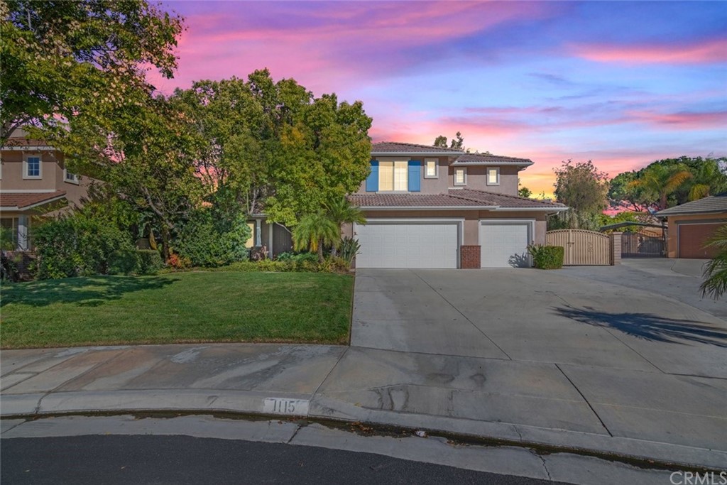 1115 Santorini Road Riverside, CA 92506 - Photo 1 of 1 front view of a house with a yard