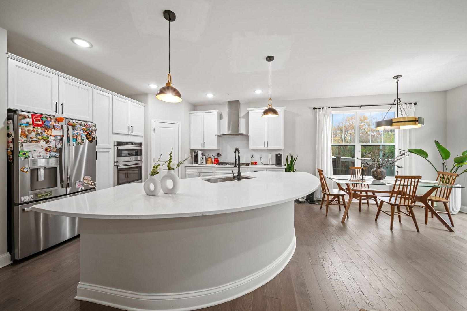 265 South Pointe Avenue South Elgin, IL 60177 - Photo 11 of 43 a large white kitchen with a large island in the center