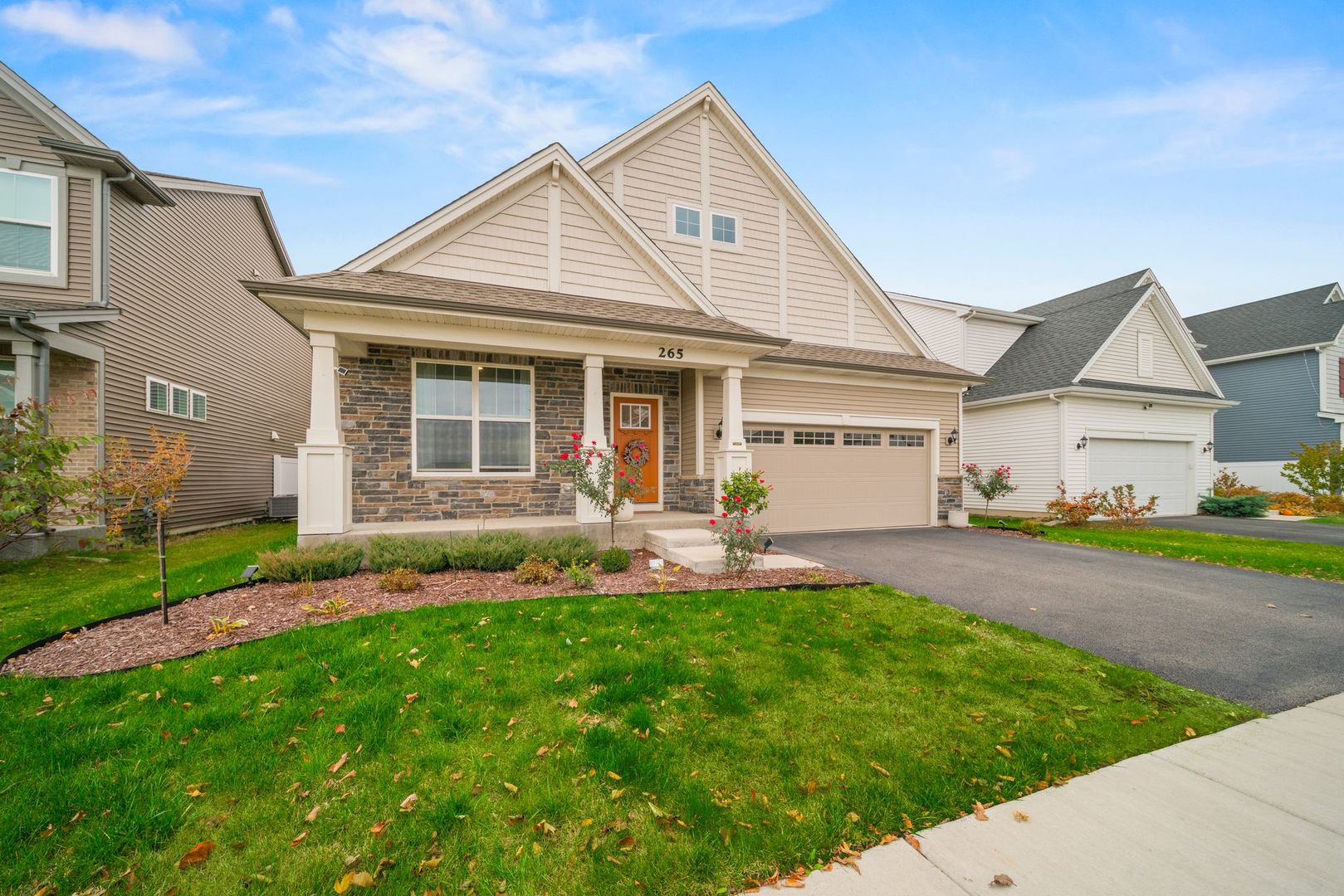 265 South Pointe Avenue South Elgin, IL 60177 - Photo 3 of 43 a front view of a house with a garden and yard