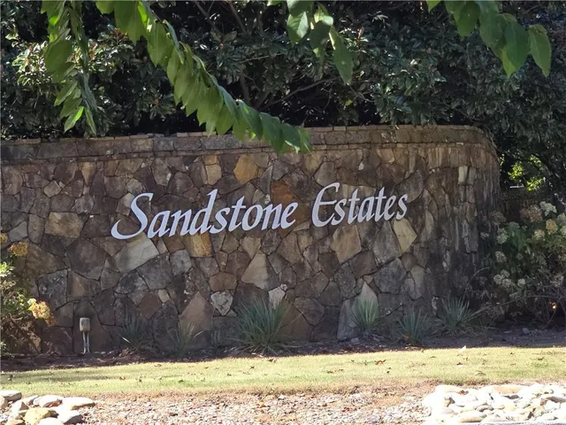 a view of outdoor space with a sign board