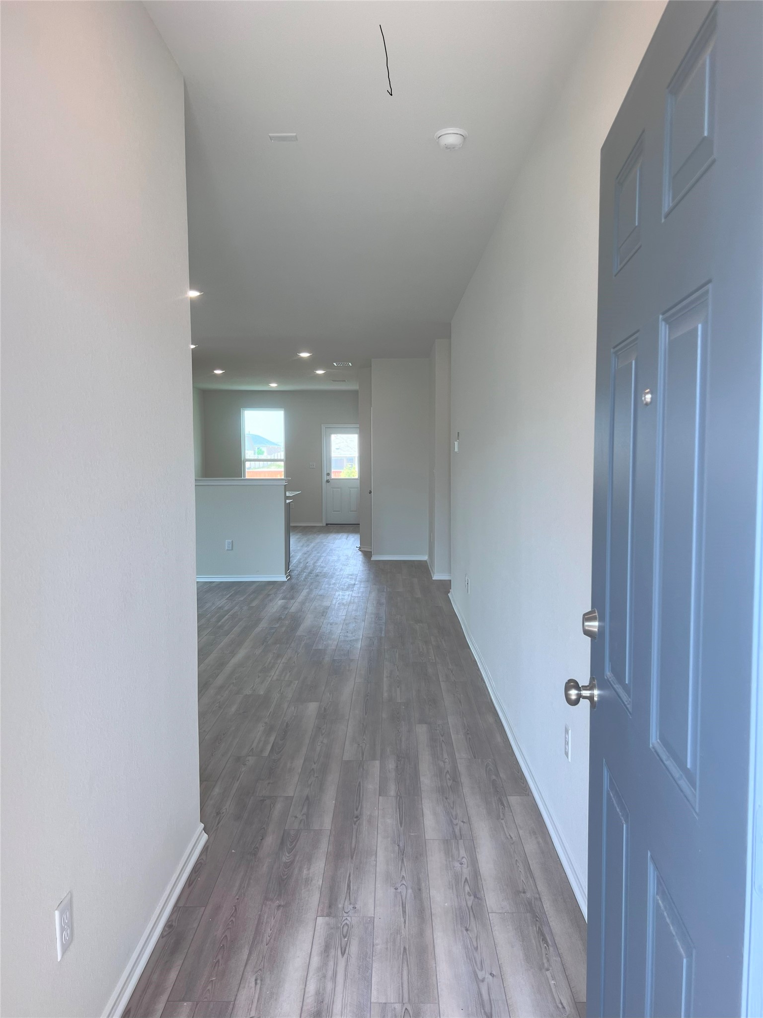427 Tree Nut Loop Buda, TX 78610 - Photo 4 of 38 a view of a room with wooden floor