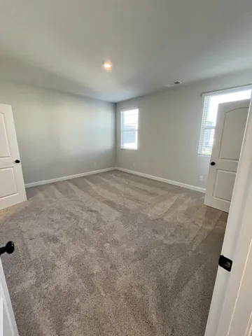 en empty room with windows