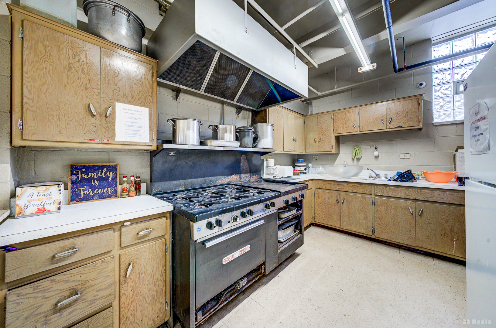 14701 Myrtle Avenue Harvey, IL 60426 - Photo 26 of 28 a kitchen with granite countertop a stove and a sink