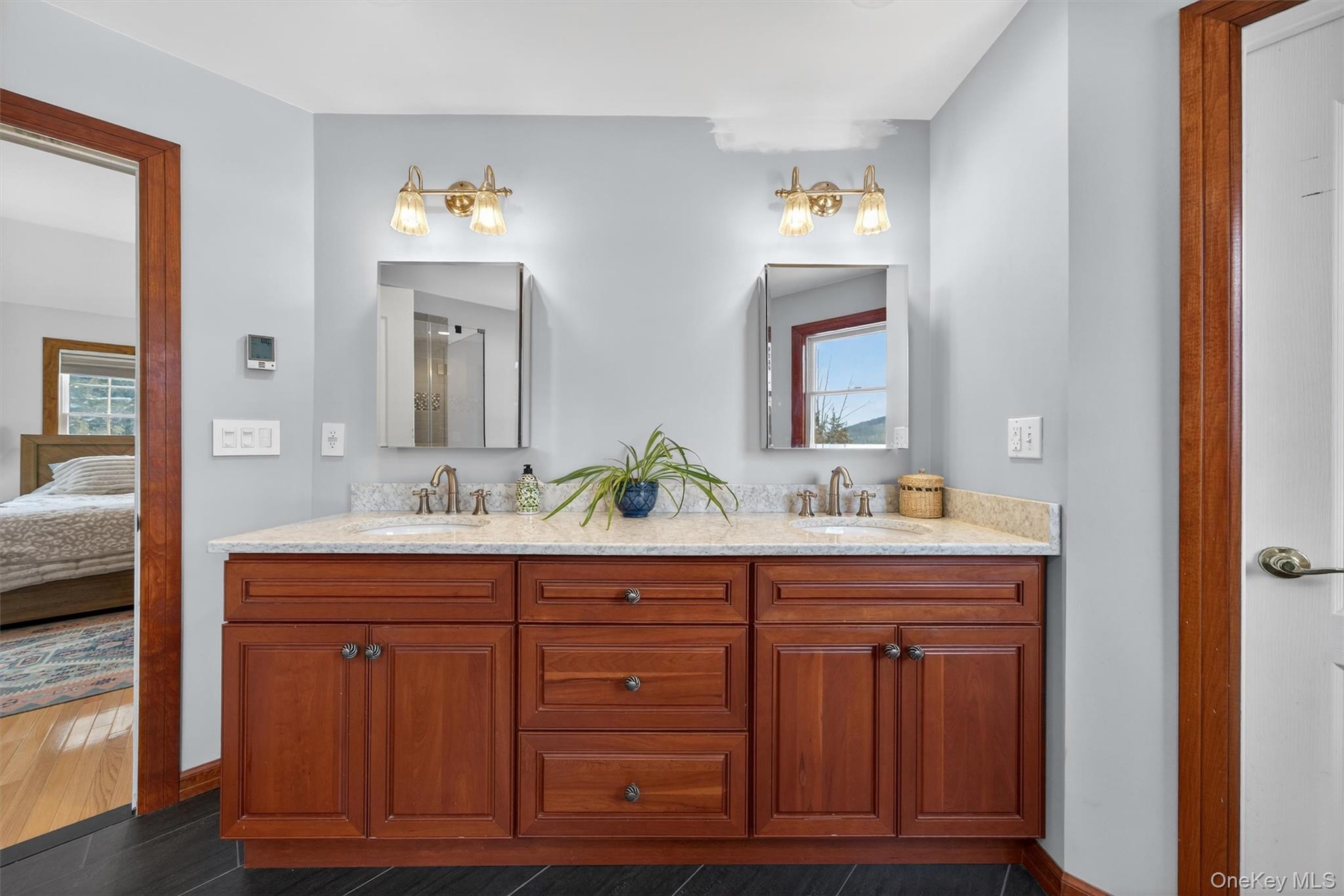 72 Coppergate Lane Warwick, NY 10990 - Photo 26 of 50 a bathroom with a granite countertop sink and a mirror