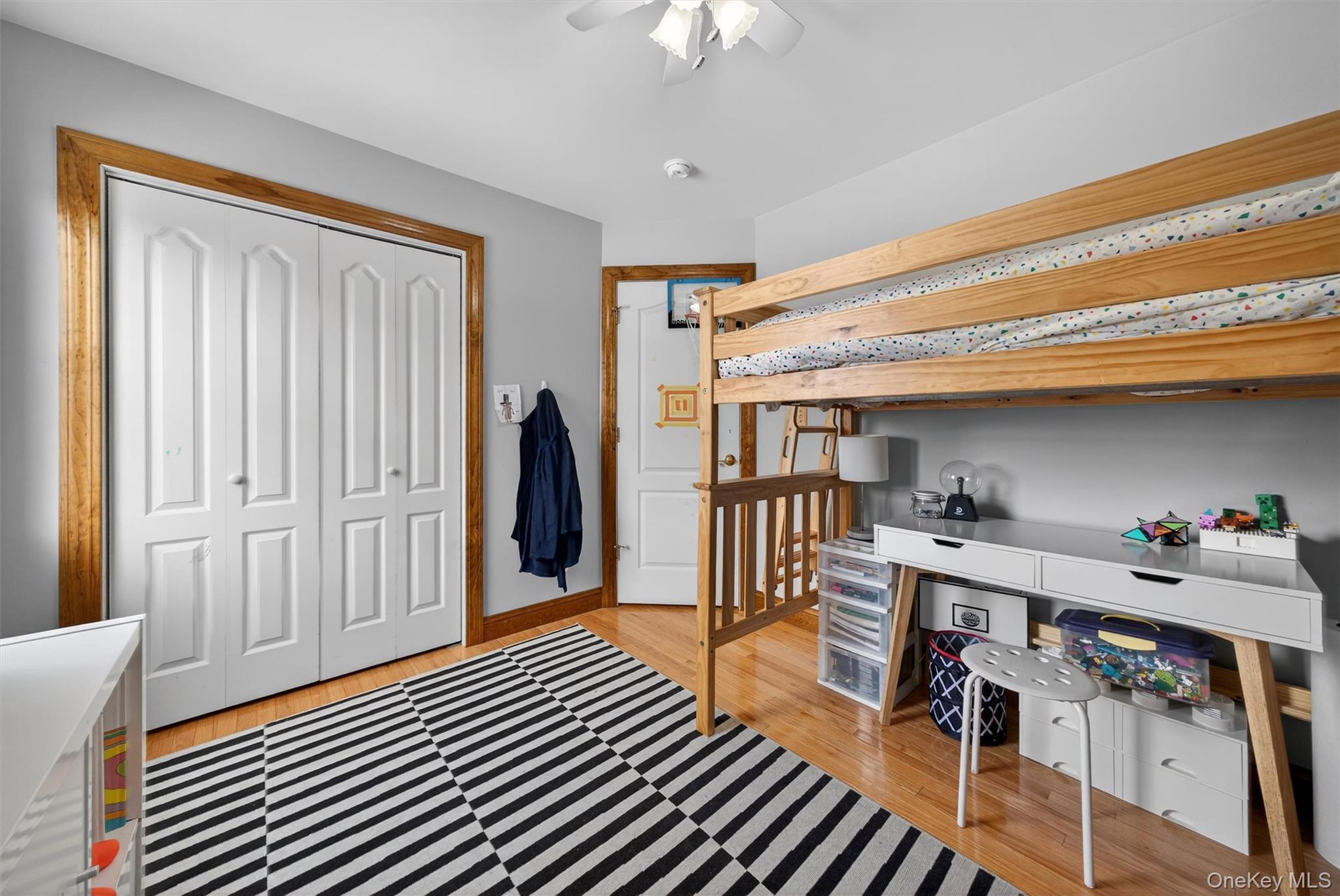 72 Coppergate Lane Warwick, NY 10990 - Photo 32 of 50 a workspace with furniture wooden floor and a chandelier