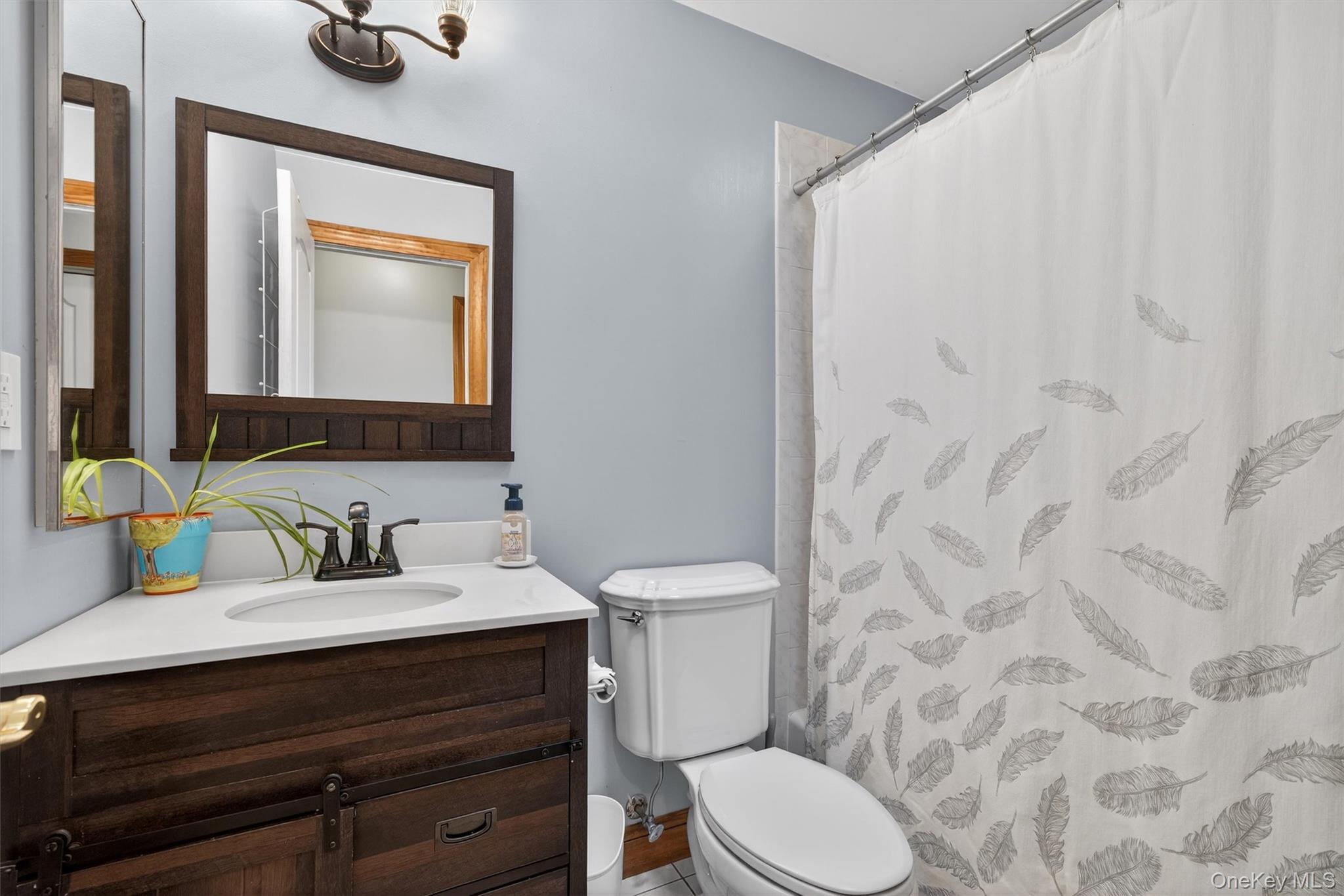 72 Coppergate Lane Warwick, NY 10990 - Photo 33 of 50 a bathroom with a sink vanity mirror and toilet