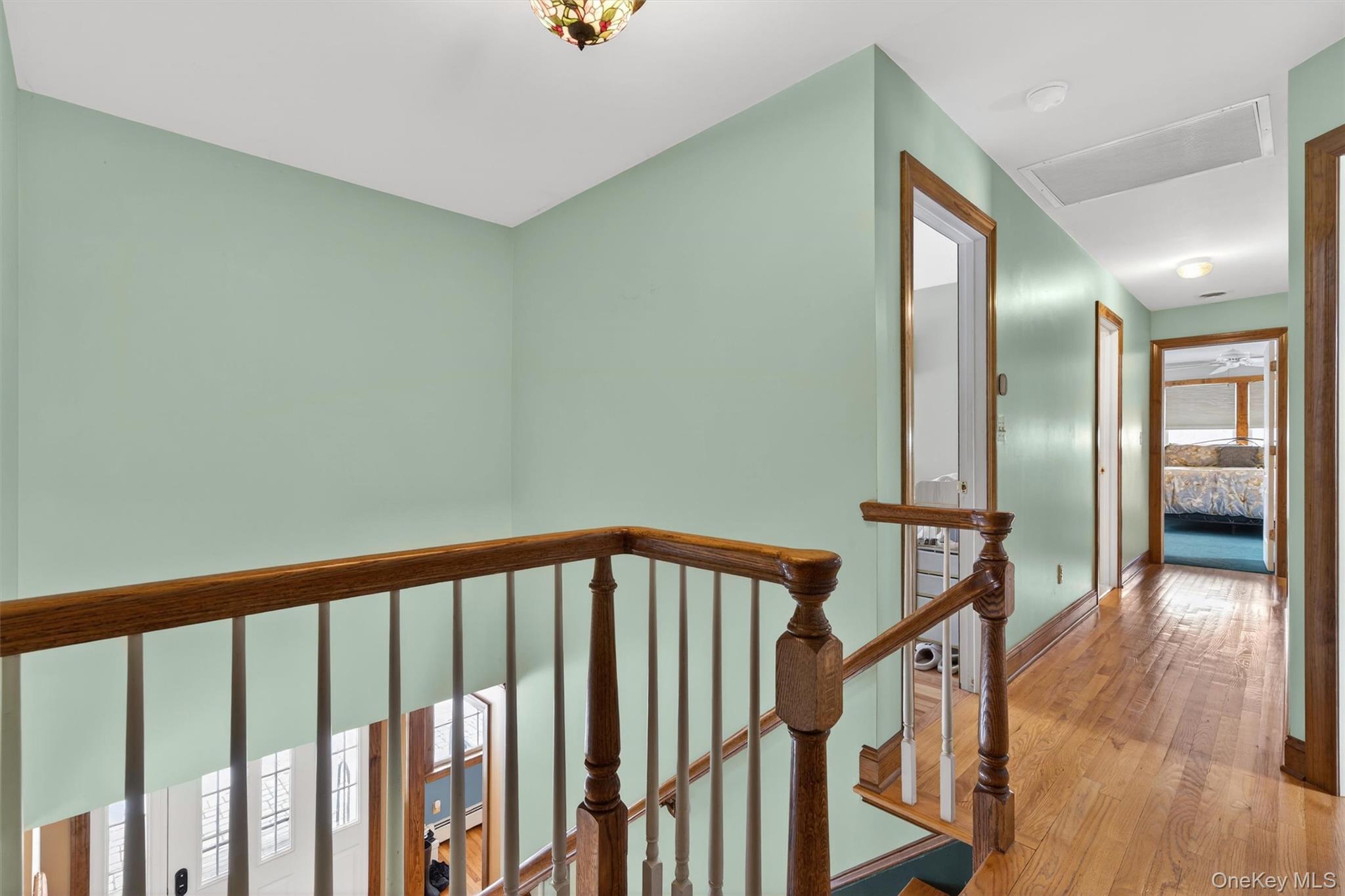 72 Coppergate Lane Warwick, NY 10990 - Photo 36 of 50 a view of a hallway with wooden floor