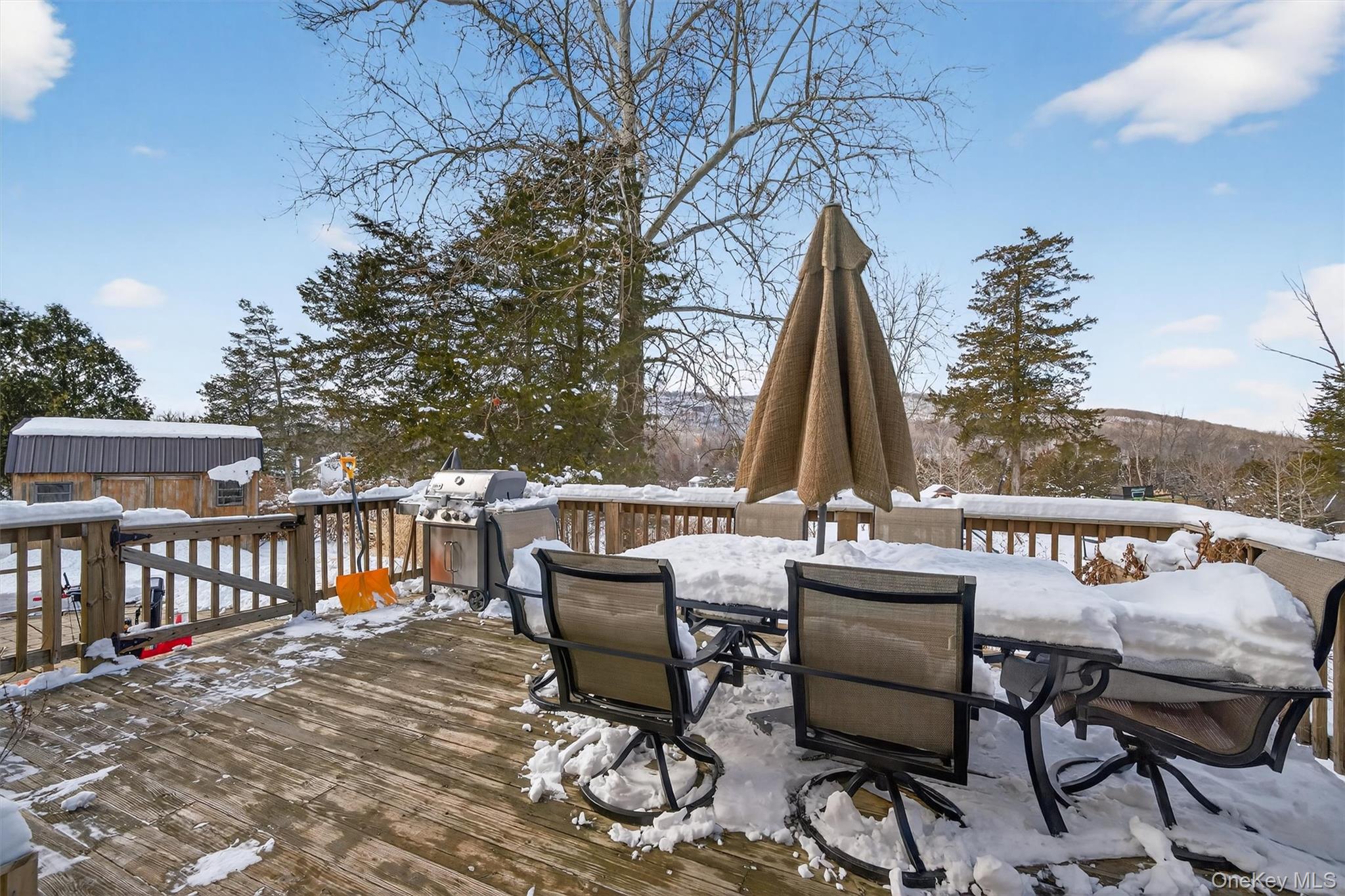 72 Coppergate Lane Warwick, NY 10990 - Photo 39 of 50 a view of a patio with a table and chairs