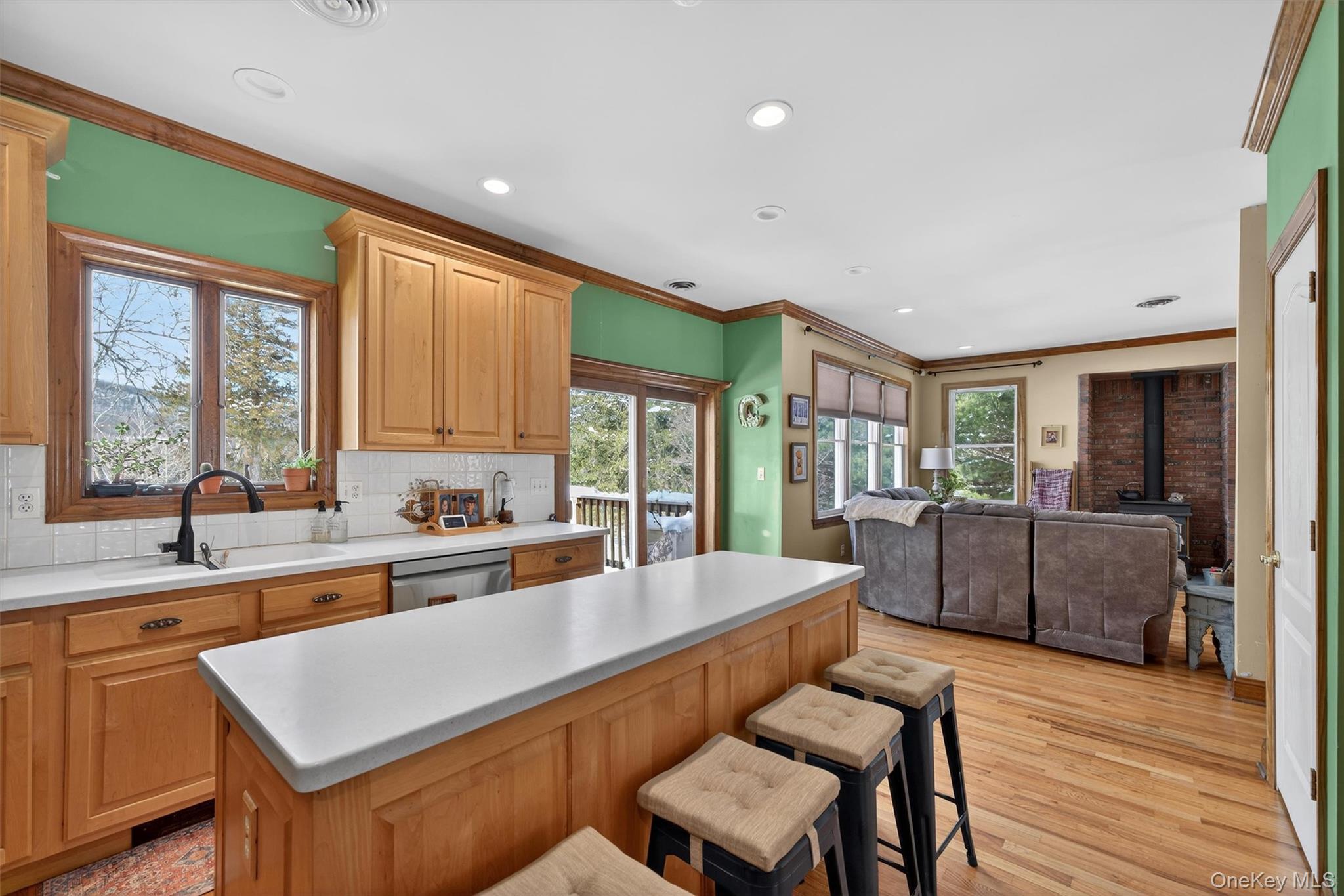 72 Coppergate Lane Warwick, NY 10990 - Photo 5 of 50 a large kitchen with sink cabinets and living room
