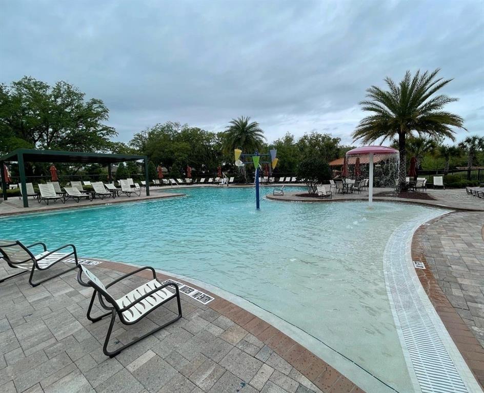 1533 Quinta Road Kissimmee, FL 34744 - Photo 14 of 16 a view of swimming pool with outdoor seating and trees