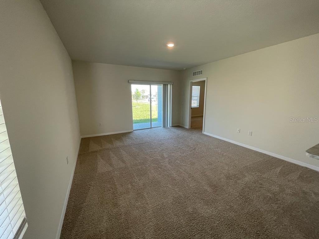 1533 Quinta Road Kissimmee, FL 34744 - Photo 6 of 16 a view of an empty room with a window