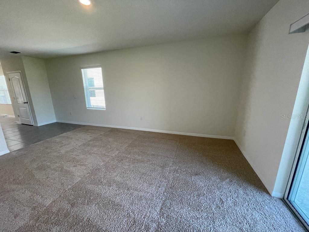 1533 Quinta Road Kissimmee, FL 34744 - Photo 8 of 16 an empty room with a window
