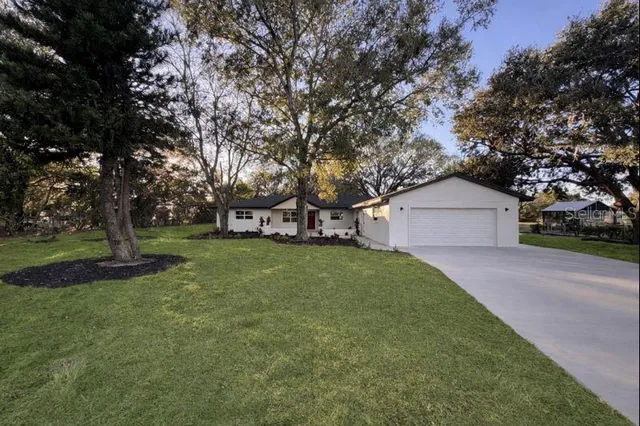 a view of a house with a yard