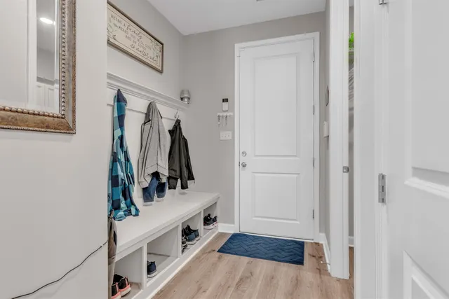 a view of an entryway with wooden floor