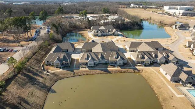an aerial view of a house with outdoor space
