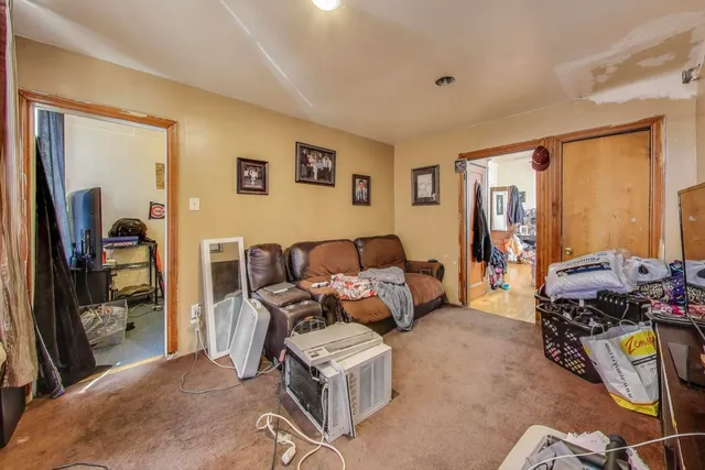 a view of a livingroom with furniture and a chandelier