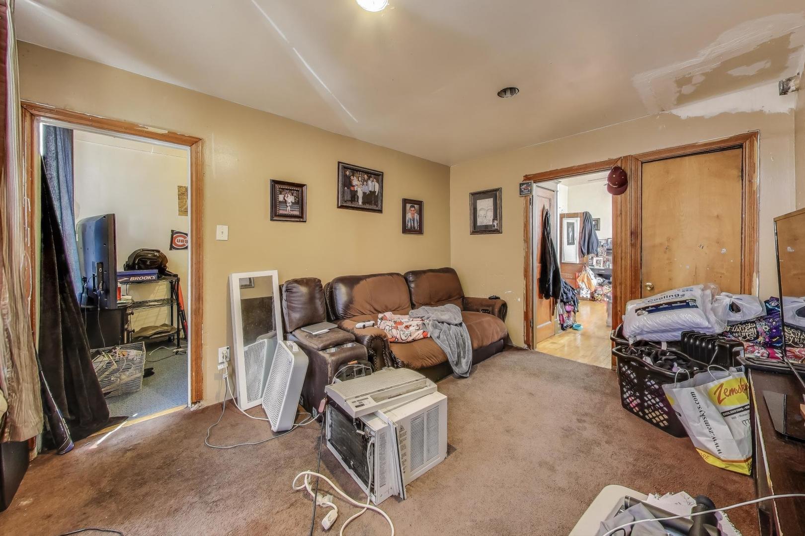 2625 South Central Park Avenue Chicago, IL 60623 - Photo 13 of 36 a bed room with a bed and a window