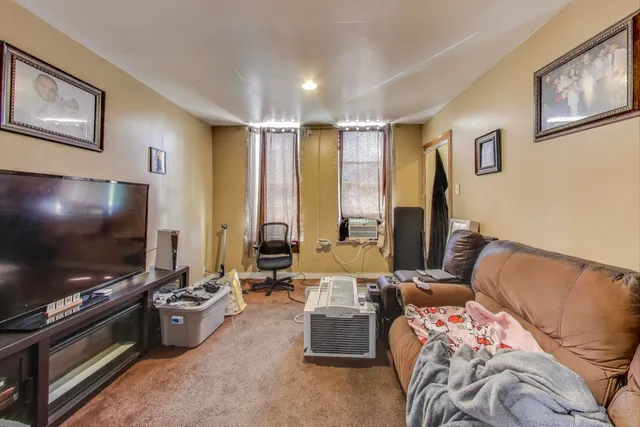 a kitchen with stainless steel appliances kitchen island granite countertop a stove and a refrigerator
