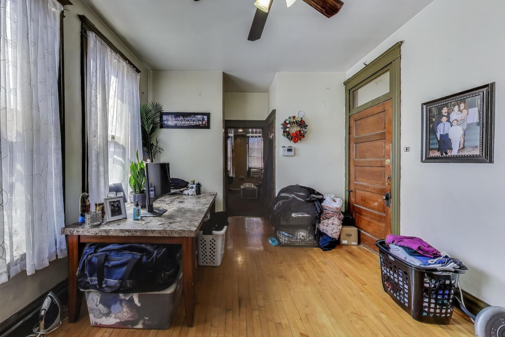 2625 South Central Park Avenue Chicago, IL 60623 - Photo 15 of 36 a bedroom with furniture and a window