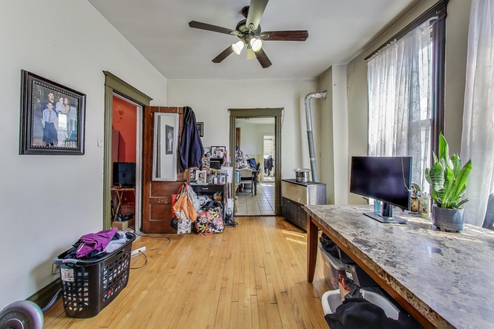 2625 South Central Park Avenue Chicago, IL 60623 - Photo 18 of 36 a view of a livingroom with furniture and a chandelier