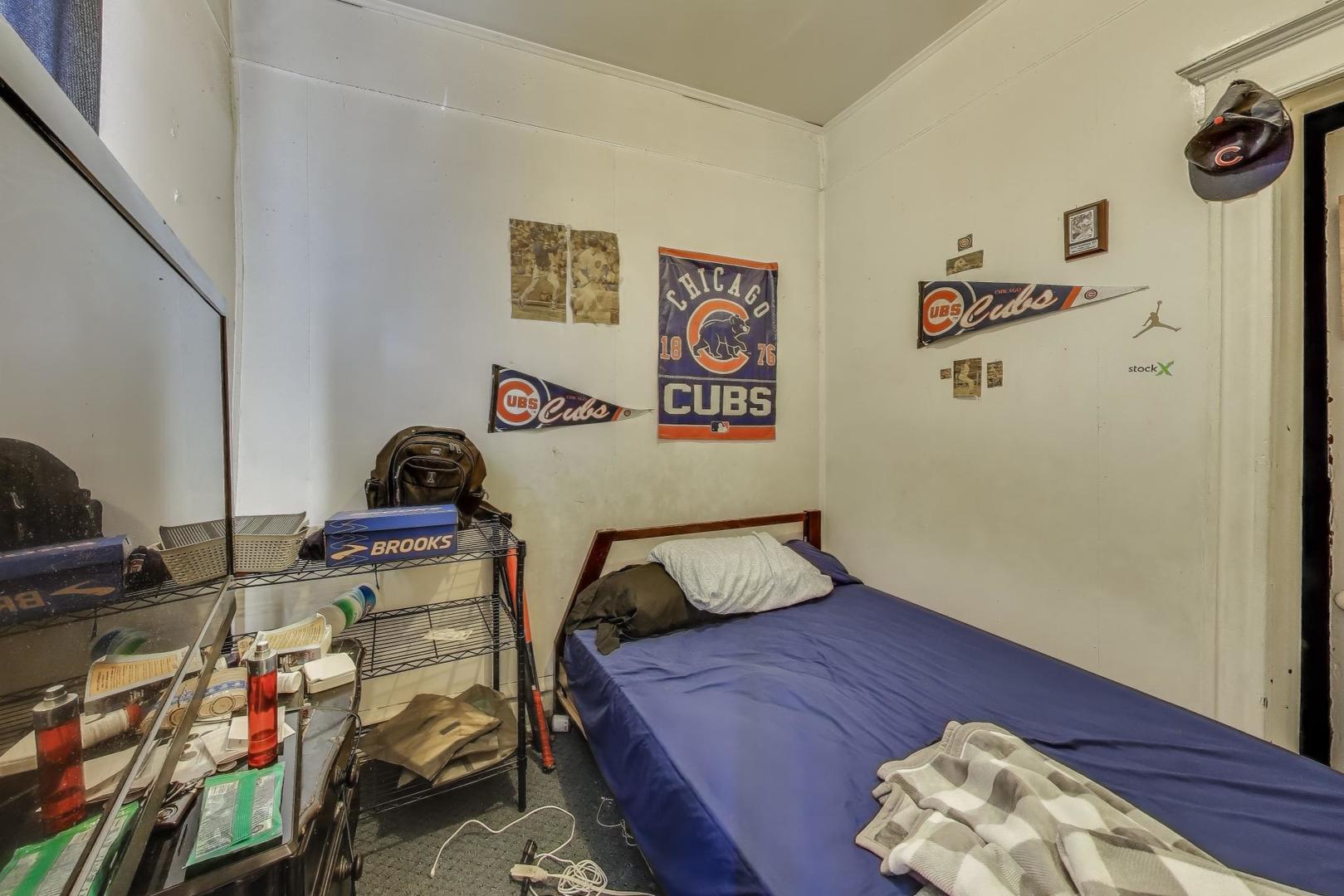 2625 South Central Park Avenue Chicago, IL 60623 - Photo 22 of 36 a bedroom with a bed and a wooden floor