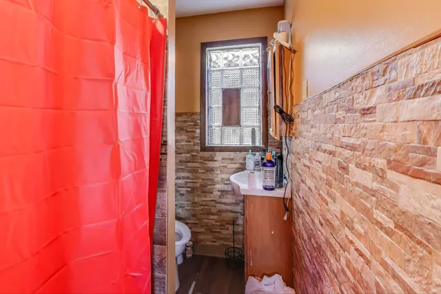 a bathroom with a bathtub sink and toilet
