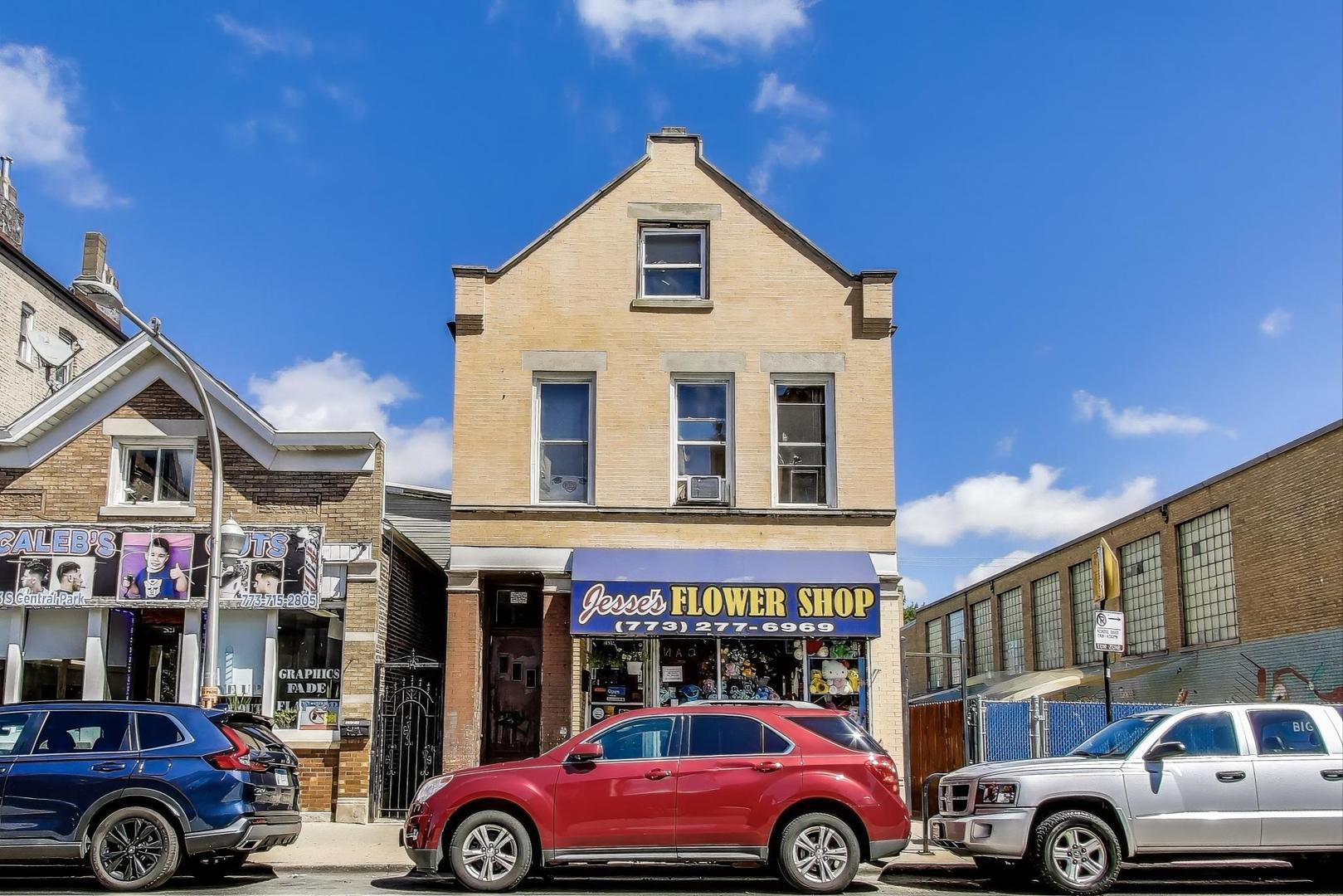 2625 South Central Park Avenue Chicago, IL 60623 - Photo 3 of 36 a front view of a building with parking space