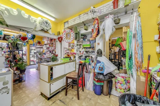a bathroom with a toilet sink and curtain