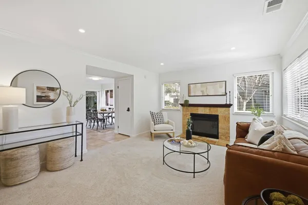 a living room with furniture and a fireplace
