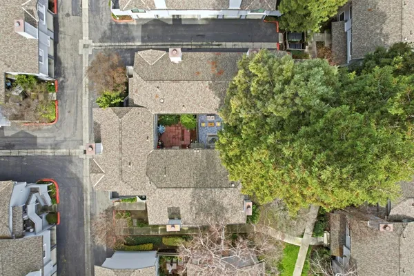 an aerial view of residential building with parking space