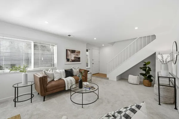 a dining room with furniture and window