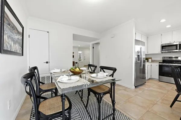 a kitchen with a sink stove and microwave