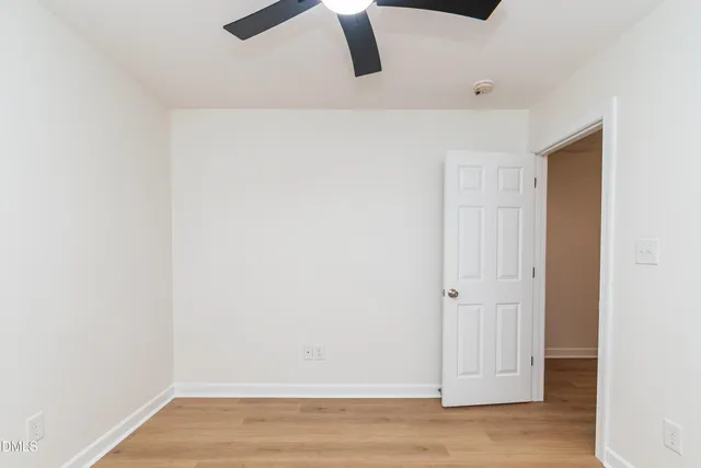 an empty room with wooden floor