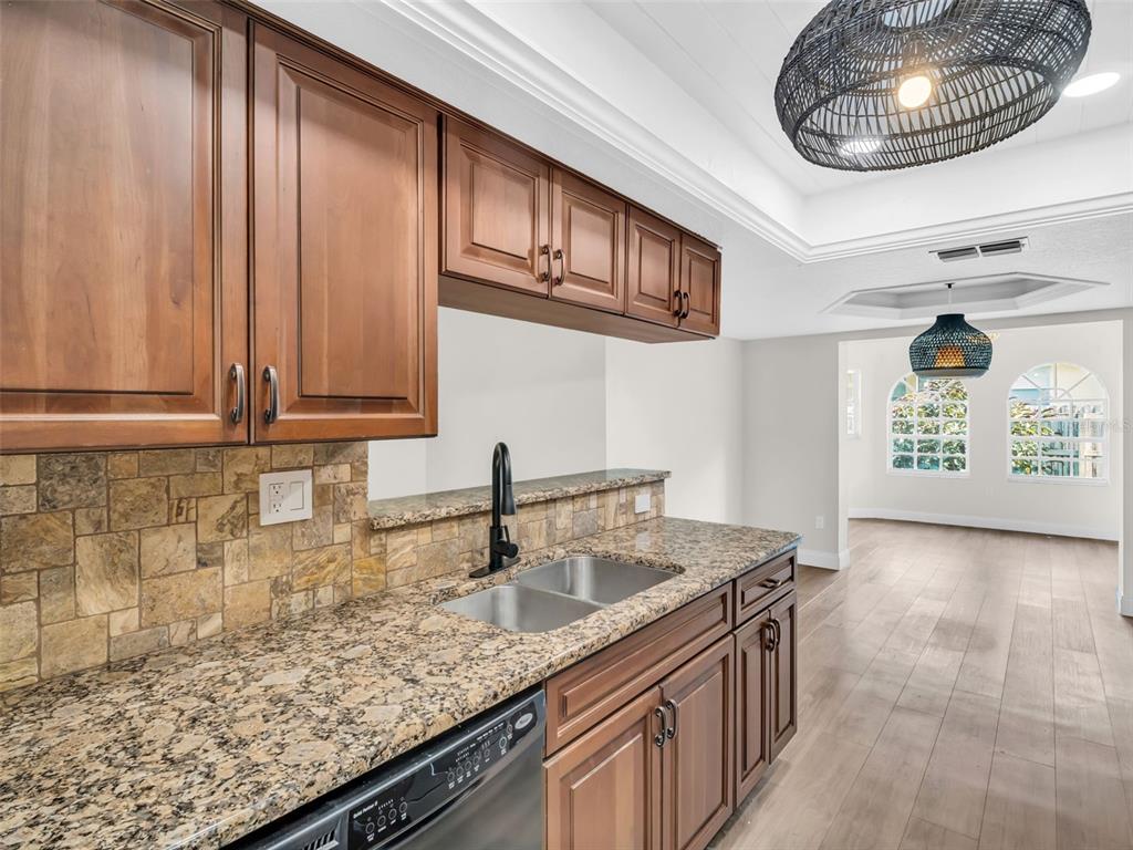 640 Kenneth Way Tarpon Springs, FL 34689 - Photo 12 of 84 a kitchen with a sink and a stove