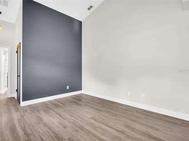 a bedroom with double bed and a window