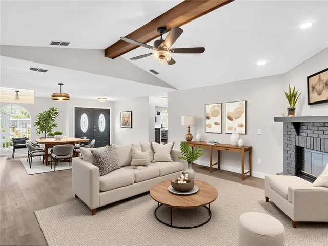 a view of a dining room with furniture wooden floor and chandelier