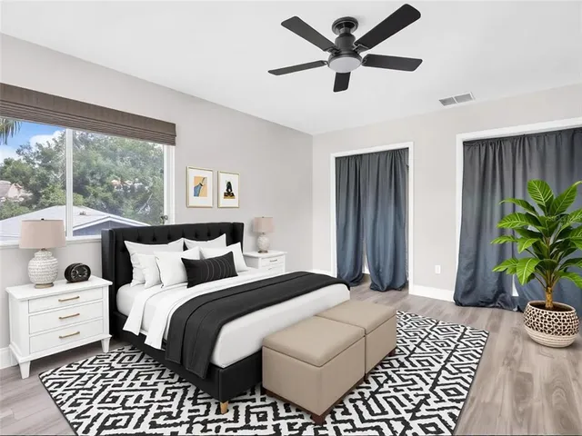 a bathroom with a granite countertop sink a mirror and a shower