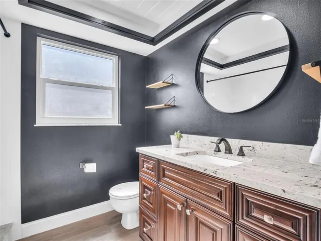 a front view of a house with a yard and porch